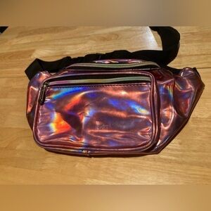 Sojourner Fanny pack in a iridescent pink color. 2 big pockets with zippers